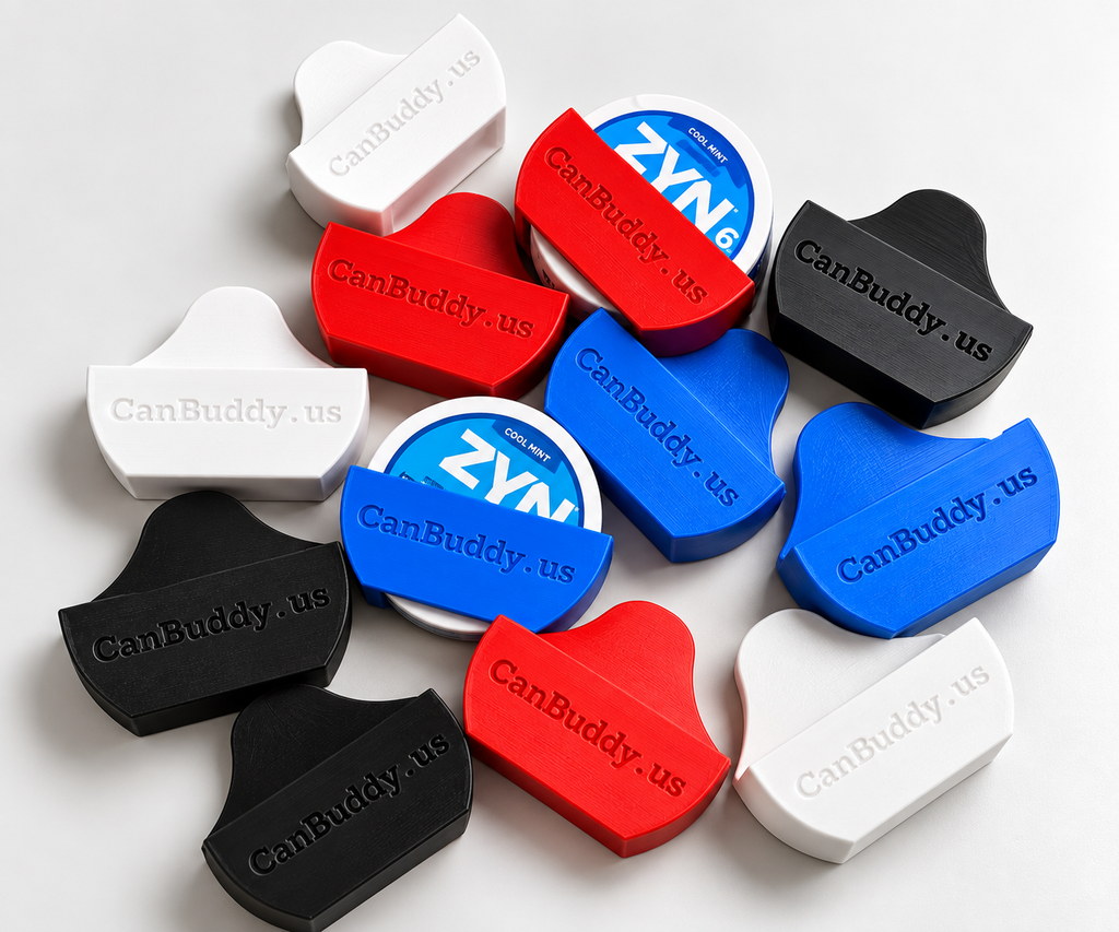 Black, white, red and blue CanBuddy holders, two holding ZYN cans